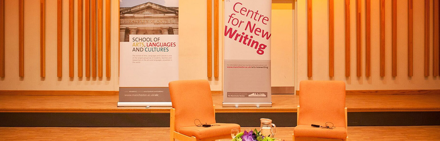 Two chairs in hall with school banner in the background