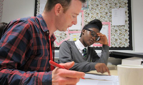 Tutor and student at a desk